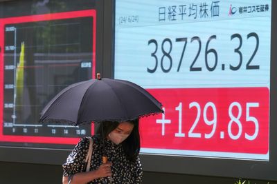 Stock market today: Asian shares lower after Wall Street closes another winning week