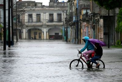 Buildings collapse and streets flood in Cuba as heavy rains pummel Havana