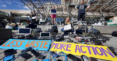 Campaigners pile electronic waste outside Holyrood ahead of circular economy vote
