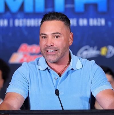 Oscar De La Hoya Showcasing Style In A Blue Polo.