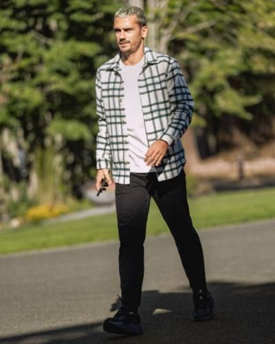 Antoine Griezmann's Stylish Outfit Choice: White Tee, Black Pants