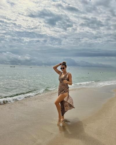 Professional Tennis Player Aryna Sabalenka Enjoying A Beach Photoshoot