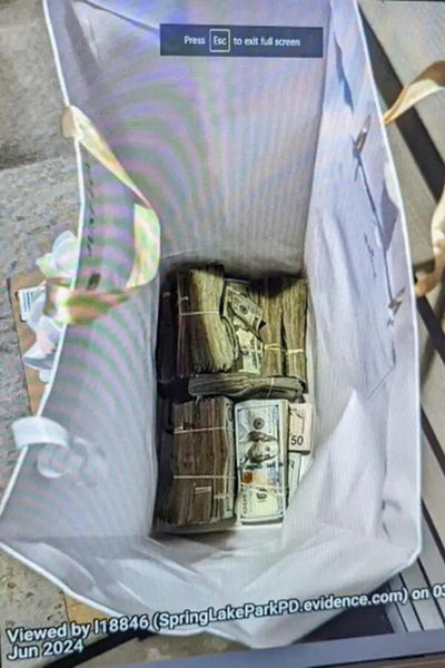 Five charged after juror receives gift bag stuffed with $120,000