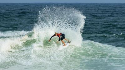 Ewing thrives in Rio surf, Robinson a shock casualty