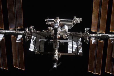 ISS astronauts take cover as defunct Russian satellite shatters