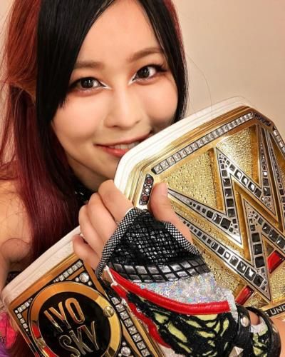 Iyo Sky Showcasing WWE Belt In Proud Moment