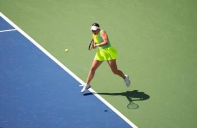 Jelena Ostapenko Shines In Vibrant Neon Attire On The Court