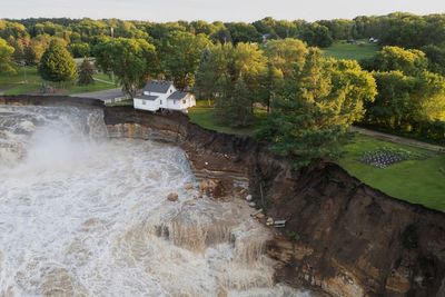 Minnesota family store is demolished from its perch near dam damaged by surging river