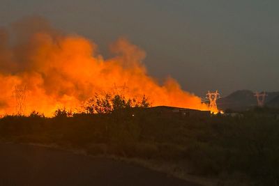 Air tankers and helicopters attack Arizona wildfire that has forced evacuations near Phoenix