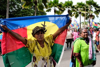 France bans election weekend rallies, extends curfew in New Caledonia