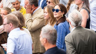 Queen Mary of Denmark's timeless striped suit with matching blue sunglasses looks gorgeous with chunky gold hoops and chic low ponytail