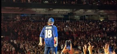 Country singer Morgan Wallen dons Peyton Manning jersey during Denver concert