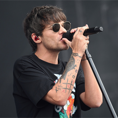 Louis Tomlinson Brings TV to Glastonbury After Festival Organizers Decline to Screen the England Soccer Match