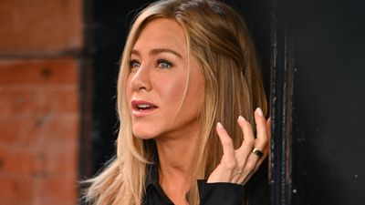 Jennifer Aniston's floral mini dress with strappy heeled sandals and cool sunnies was the dreamiest dressed up summer day look