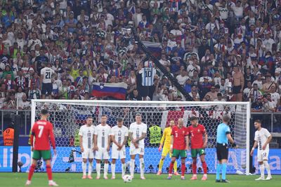 Slovenia fans mock Cristiano Ronaldo and hold up ‘Messi’ shirts – BEFORE Portugal captain's penalty miss