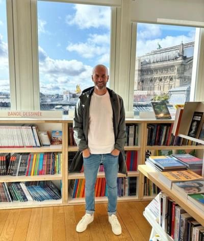 Zinedine Zidane's Stylish Pose In Serene Library Setting