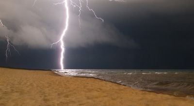 Girl, 13, killed instantly by lightning yards from her parents on Greek beach