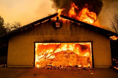 Northern California wildfire spreads, with more hot weather expected. Thousands evacuate