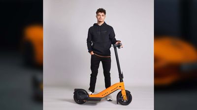 F1 Driver Lando Norris Looks 'Very Happy' Modeling This EV Scooter