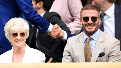 Sandra Beckham wows with crisp white blazer and berry pink nails at Wimbledon with David