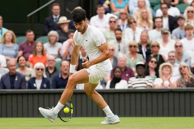 Defending Wimbledon champion Carlos Alcaraz comes back to beat Frances Tiafoe in the third round