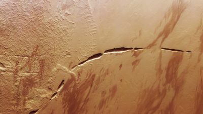 Grand Canyon-size 'scar' on Mars revealed like never before in striking new satellite photos