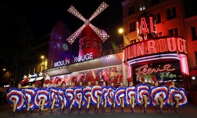 Moulin Rouge in Paris celebrates installation of new windmill sails