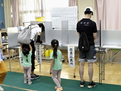 Voters in Tokyo cast ballots to decide whether to re-elect incumbent conservative as city's governor