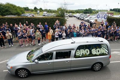 Thousands gather to pay final respects to Rob Burrow on funeral route