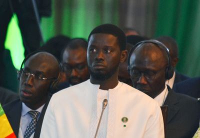 Senegal’s leader wasn't born when ECOWAS was founded. He's asked to reunite the bloc split by coups
