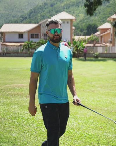 Renato Núñez Showcasing Stylish Golf Attire In Blue And Black.