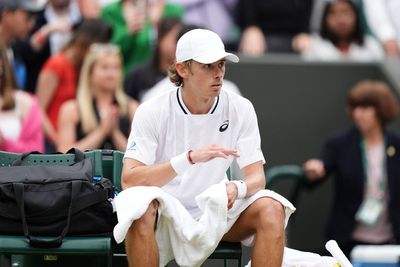 Alex De Minaur reaches first Wimbledon quarter-final but suffers injury scare