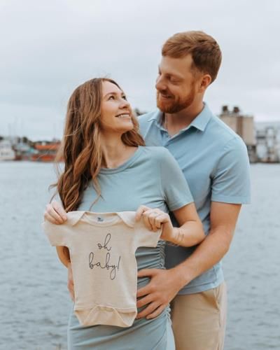 Excited Couple In Light Blue Anticipating Baby Boy's Arrival