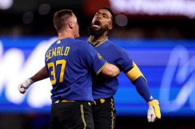 Teoscar Hernández And Teammates Celebrate Baseball Victory Together