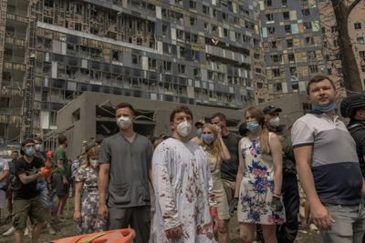 Mourning In Kyiv As Rescuers Clear Rubble From Children's Hospital