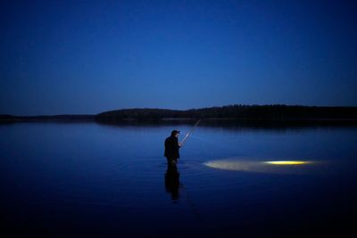 As climate change alters lakes, tribes and conservationists fight for the future of spearfishing