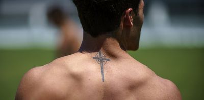 At the Olympics, athletes show guts, glory – and a lot of ink, including tattoos that profess their faith