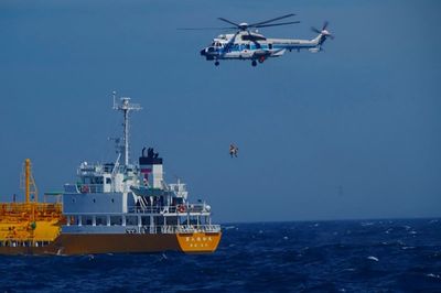 Woman swept to sea while swimming at a Japanese beach is rescued 37 hours later and 50 miles away