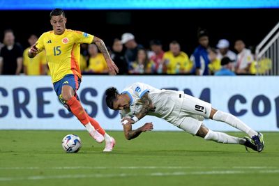 Uruguayan players brawl with Colombian fans at the stands after Copa America semifinal loss