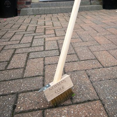 I tried Newman and Cole's long-handle weed brush from Amazon and it made paving block weeding a breeze