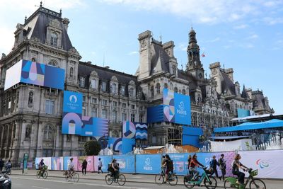 ‘It might actually be cool’: wary Parisians seduced by prospect of Olympics