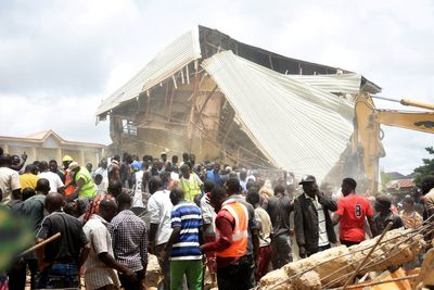 Dozens of students killed and more than 100 trapped after school building collapses in Nigeria