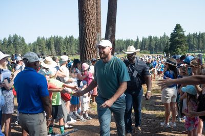 Travis Kelce delightfully kissed a man’s arm after he hit the guy with a golf shot in Lake Tahoe