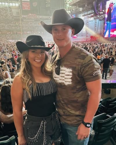 Stylish Couple In Matching Black Hats: Matt And Wife Pose