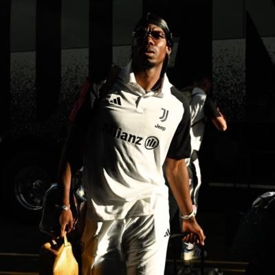 Paul Pogba Arrives In Team Tracksuit With Stylish Confidence