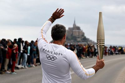 France's Bastille Day parade meets the Olympic torch relay in an exceptional year