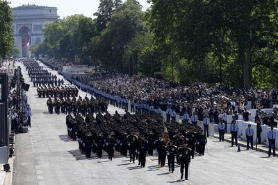 France's annual Bastille Day parade highlights Olympic flame relay, D-Day landings