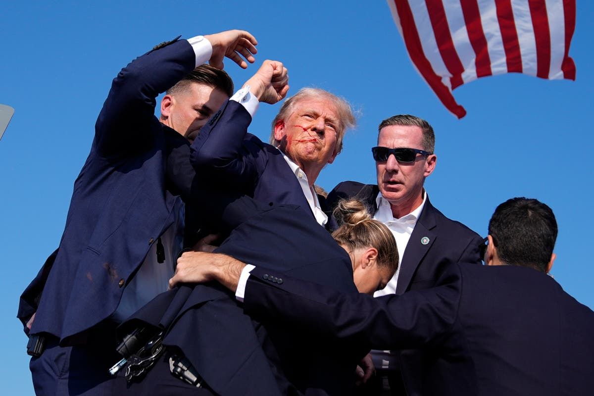 Amid chaos and gunfire, Trump raised his fist and…