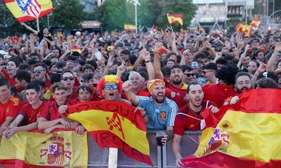Flying the flag: Spanish fans gather in Madrid to cheer team to victory