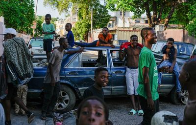 AP PHOTOS: In documenting violence in Haiti, you find bodies, but also ways people keep on living